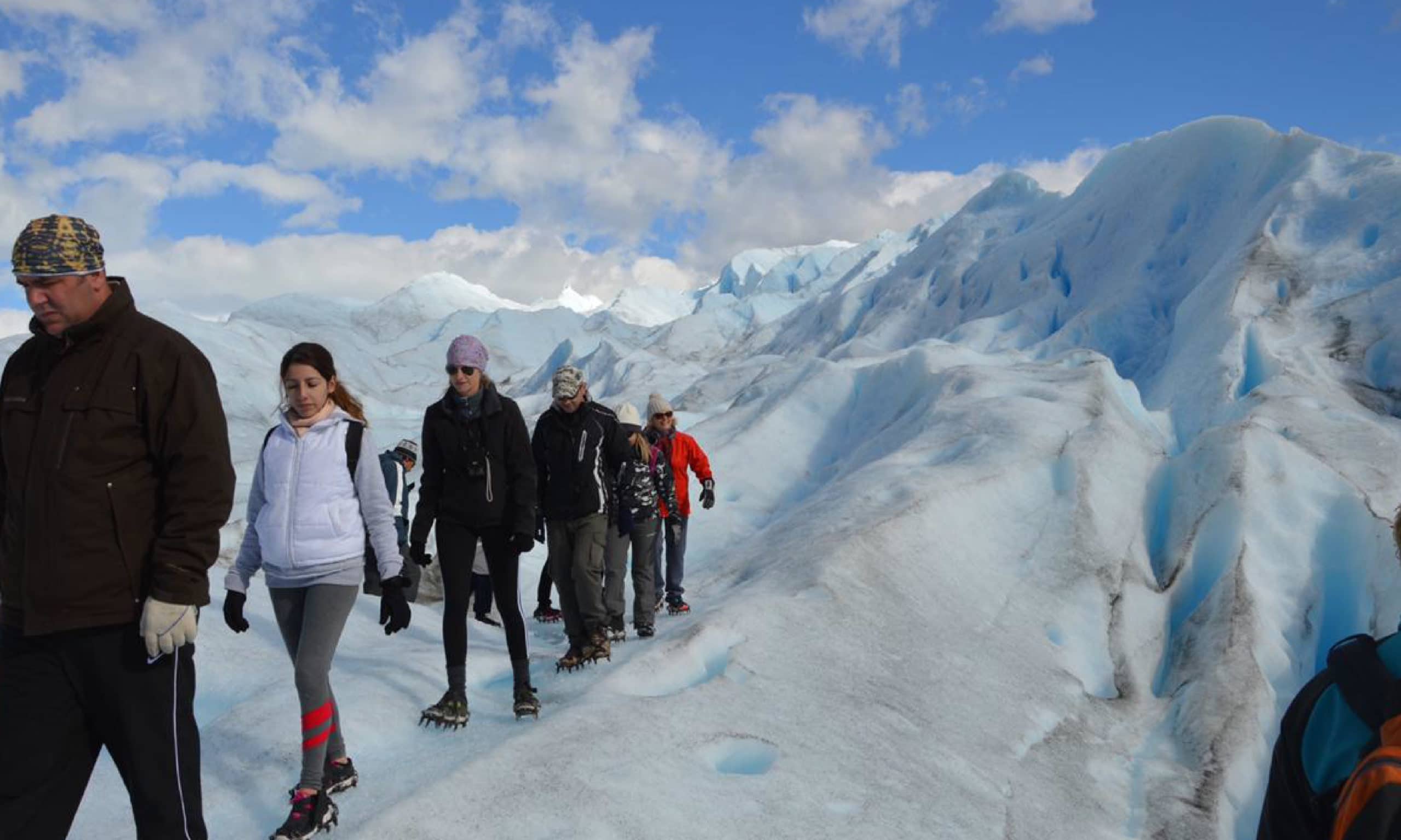 People trekking on Perito Moreno glacier.