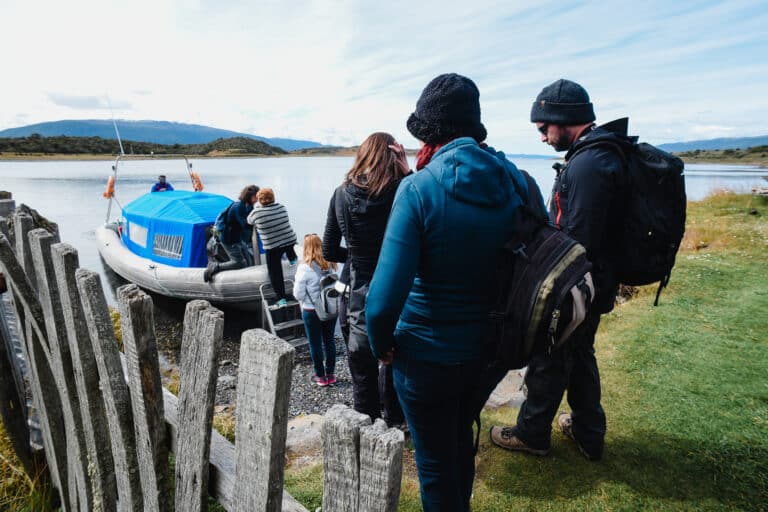 People getting on a boat on Martillo Island.